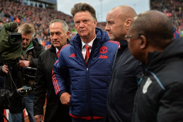 Manchester United's Dutch manager Louis van Gaal (C) leaves after the English Premier League football match between Stoke City and Manchester United at the Britannia Stadium in Stoke-on-Trent, central England on December 26, 2015. Stoke won the game 2-0. AFP PHOTO / PAUL ELLIS

RESTRICTED TO EDITORIAL USE. No use with unauthorized audio, video, data, fixture lists, club/league logos or 'live' services. Online in-match use limited to 75 images, no video emulation. No use in betting, games or single club/league/player publications.. / AFP / PAUL ELLIS        (Photo credit should read PAUL ELLIS/AFP/Getty Images)