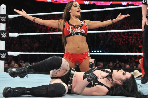 Brie Bella and Nikki Bella, known as the Bella Twins, compete during Wrestlemania XXX at the Mercedes-Benz Super Dome in New Orleans on Sunday, April 6, 2014. (Jonathan Bachman/AP Images for WWE)