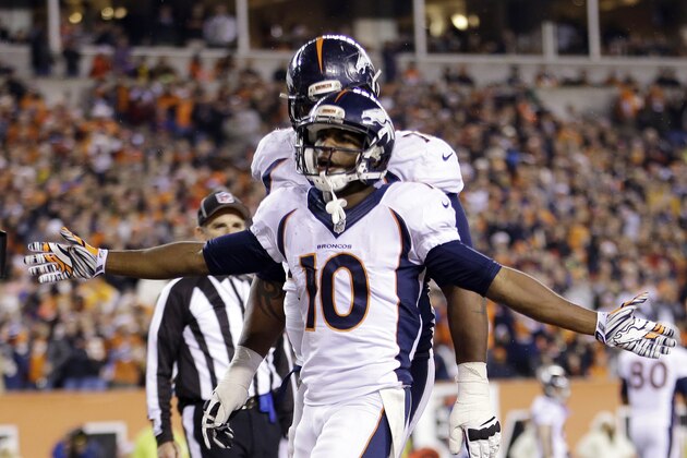 Denver Broncos wide receiver Emmanuel Sanders celebrates a touchdown catch against the Cincinnati Bengals during the second half of an NFL football game Monday, Dec. 22, 2014, in Cincinnati. (AP Photo/AJ Mast)