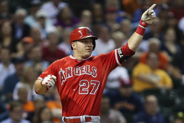 Sep 22, 2015; Houston, TX, USA; Los Angeles Angels center fielder Mike Trout (27) celebrates after scoring on an inside the park home run during the first inning against the Houston Astros at Minute Maid Park. Mandatory Credit: Troy Taormina-USA TODAY Sports Sep 22, 2015; Houston, TX, USA; Los Angeles Angels center fielder Mike Trout (27) celebrates after scoring on an inside the park home run during the first inning against the Houston Astros at Minute Maid Park. Mandatory Credit: Troy Taormina-USA TODAY Sports