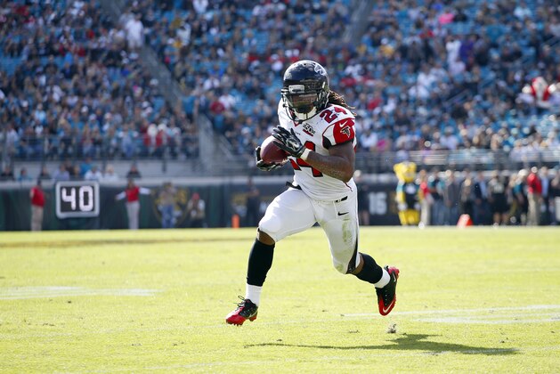 Atlanta Falcons running back Devonta Freeman (24) runs the ball for a touchdown against the Jacksonville Jaguars during an NFL football game in Jacksonville, Fla., Sunday, Dec. 20, 2015. (Jeff Haynes/AP Images for Panini)