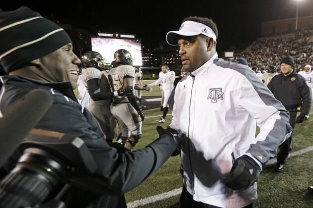 Texas A&M head coach Kevin Sumlin, right, meets Vanderbilt head coach Derek Mason on the field after an NCAA college football game Saturday, Nov. 21, 2015, in Nashville, Tenn. (AP Photo/Mark Humphrey)