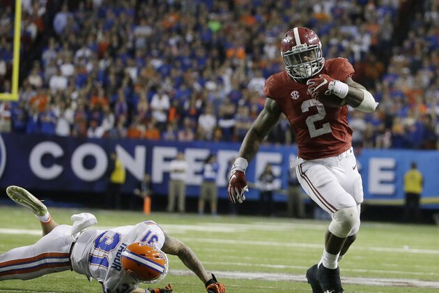FILE - In this Dec. 15, 2015, file photo, Alabama running back Derrick Henry (2) runs by Florida defensive back Jalen Tabor (31) during the second half of the Southeastern Conference championship NCAA college football game, in Atlanta.  College football will have a record 41 bowls this season, including the national championship game. (AP Photo/David Goldman, File)