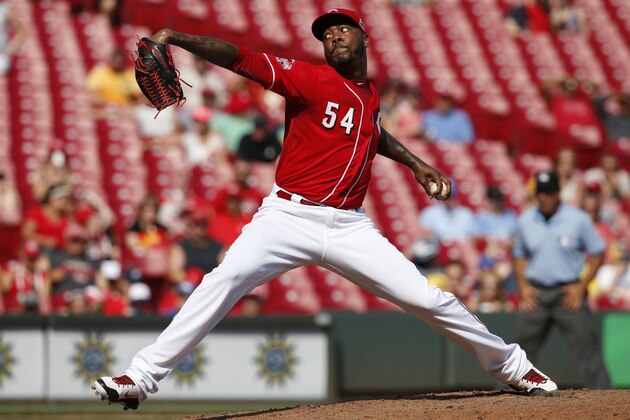 Cincinnati Reds relief pitcher Aroldis Chapman throws in the ninth inning of a baseball game against the Milwaukee Brewers, Sunday, Sept. 6, 2015, in Cincinnati. (AP Photo/John Minchillo)
