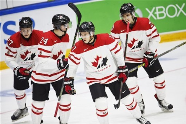 From left: Canada's Mitchell Stephens, Travis Dermott, Travis Konecny and Roland McKeown celebrate the 4-1 goal during the 2016 IIHF World Junior Ice Hockey Championship match between Canada and Denmark in Helsinki, Finland, Monday, Dec. 28, 2015. (Roni Rekomaa/Lehtikuva via AP)   FINLAND OUT