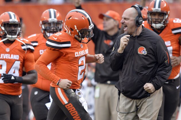 Cleveland Browns head coach Mike Pettine, right, celebrates a touchdown pass by quarterback Johnny Manziel (2) during the second half of an NFL football game against the San Francisco 49ers, Sunday, Dec. 13, 2015, in Cleveland. (AP Photo/David Richard)