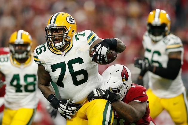 GLENDALE, AZ - DECEMBER 27: Defensive end Mike Daniels #76 of the Green Bay Packers runs with the football after an inceptions in the second quarter of the NFL game against the Arizona Cardinals at the University of Phoenix Stadium on December 27, 2015 in Glendale, Arizona.  (Photo by Christian Petersen/Getty Images)