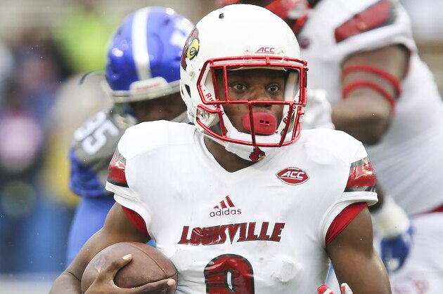 Louisville quarterback Lamar Jackson scrambles out of the pocket during the second half of an NCAA college football game against Kentucky, Saturday, Nov. 28, 2015, in Lexington, Ky. Louisville won the game 38-24. (AP Photo/David Stephenson)