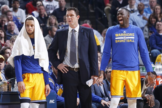 INDIANAPOLIS, IN - DECEMBER 8: Interim coach Luke Walton looks on alongside Draymond Green #23 and Stephen Curry #30 of the Golden State Warriors in the first half of the game against the Indiana Pacers at Bankers Life Fieldhouse on December 8, 2015 in Indianapolis, Indiana. The Warriors defeated the Pacers 131-123 to move to 23-0 on the season. NOTE TO USER: User expressly acknowledges and agrees that, by downloading and or using the photograph, User is consenting to the terms and conditions of the Getty Images License Agreement. (Photo by Joe Robbins/Getty Images)