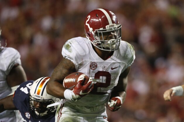 Alabama running back Derrick Henry (2) runs the ball and scores a touchdown during the second half of an NCAA college football game, Saturday, Nov. 28, 2015, in Auburn, Ala. Alabama won 29-13. (AP Photo/Gerald Herbert)