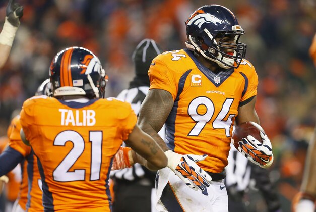 Denver Broncos outside linebacker DeMarcus Ware (94) celebrates his fumble recovery for the win after an NFL football game against the Cincinnati Bengals, Monday, Dec. 28, 2015, in Denver. The Broncos won 20-17 in overtime. (AP Photo/Joe Mahoney)