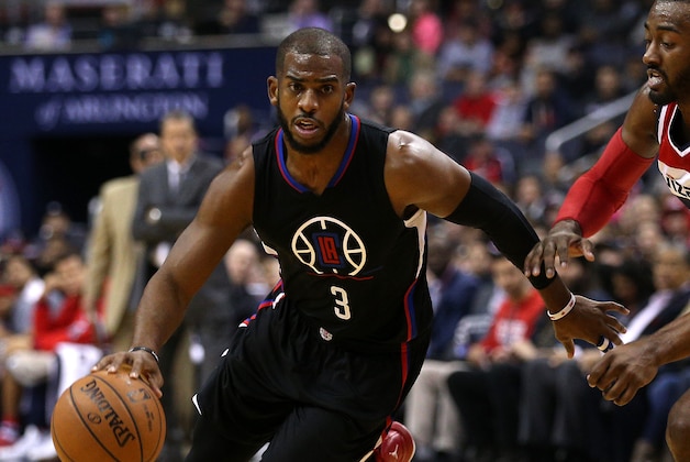 WASHINGTON, DC - DECEMBER 28: Chris Paul #3 of the Los Angeles Clippers dribbles past John Wall #2 of the Washington Wizards during the first half at Verizon Center on December 28, 2015 in Washington, DC. NOTE TO USER: User expressly acknowledges and agrees that, by downloading and or using this photograph, User is consenting to the terms and conditions of the Getty Images License Agreement. (Photo by Patrick Smith/Getty Images)