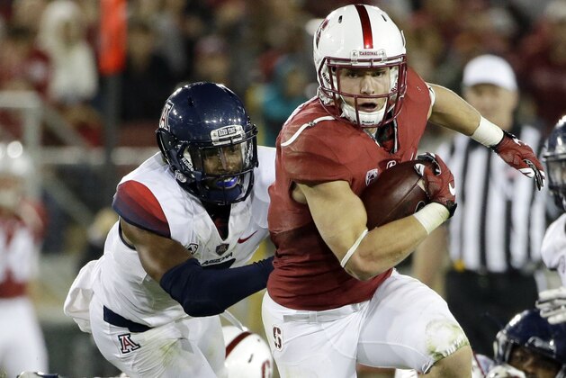 FILE - In this Oct. 3, 2015, file photo, Stanford's Christian McCaffrey rushes against Arizona during an NCAA college football game in Stanford, Calif. McCaffrey was selected as The Associated Press college football player of the year on Tuesday, Dec. 22, 2015, becoming the first non-Heisman Trophy winner to earn the honor in six years. (AP Photo/Marcio Jose Sanchez, File)