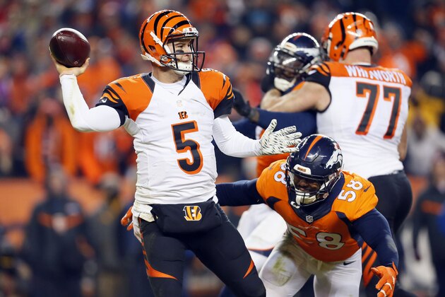 Cincinnati Bengals quarterback AJ McCarron (5) throws as Denver Broncos outside linebacker Von Miller (58) pursues during the second half of an NFL football game, Monday, Dec. 28, 2015, in Denver. (AP Photo/Joe Mahoney)