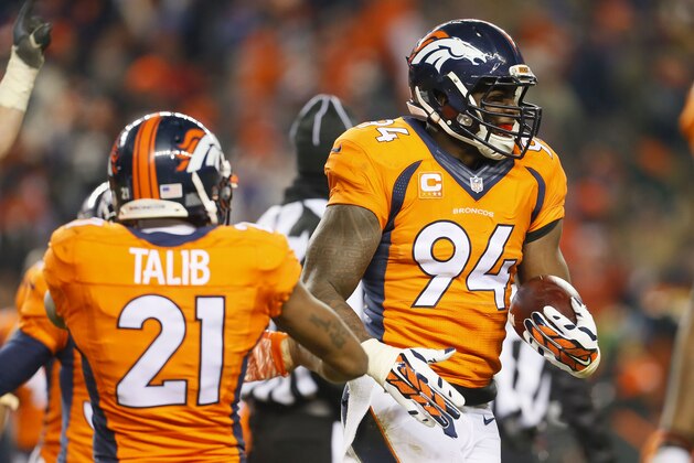 Denver Broncos outside linebacker DeMarcus Ware (94) celebrates his fumble recovery for the win after an NFL football game against the Cincinnati Bengals, Monday, Dec. 28, 2015, in Denver. The Broncos won 20-17 in overtime. (AP Photo/Joe Mahoney)