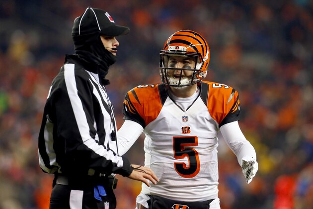 Cincinnati Bengals quarterback AJ McCarron (5) talk with an official during the first half of an NFL football game against the Denver Broncos, Monday, Dec. 28, 2015, in Denver. (AP Photo/Joe Mahoney)