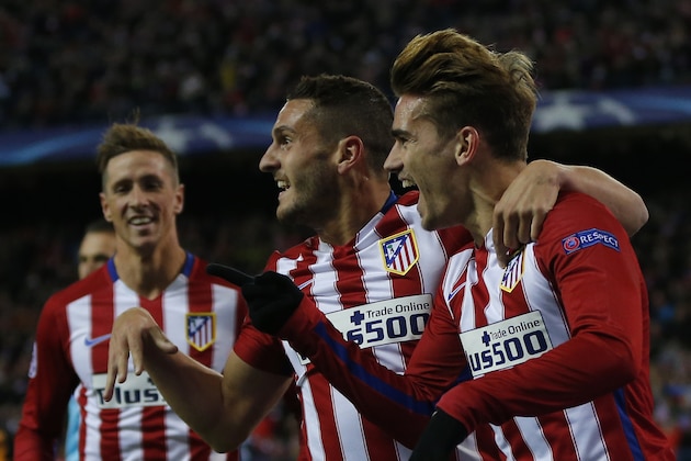 Atletico's Antoine Griezmann, right, celebrates with Koke, center and Fernando Torres after scoring the opening goal during the Champions League Group C soccer match between Atletico Madrid and Galatasaray at the Vicente Calderon stadium in Madrid, Spain, Wednesday Nov. 25, 2015. (AP Photo/Daniel Ochoa de Olza)