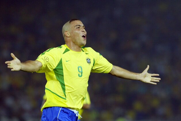 Brazil's forward Ronaldo celebrates after scoring the second goal against Germany during match 64 of the 2002 FIFA World Cup Korea Japan final 30 June, 2002 in Yokohama, Japan. Brazil won the championship 2-0, having now won a record five World Cup titles.AFP PHOTO GABRIEL BOUYS        (Photo credit should read GABRIEL BOUYS/AFP/Getty Images)