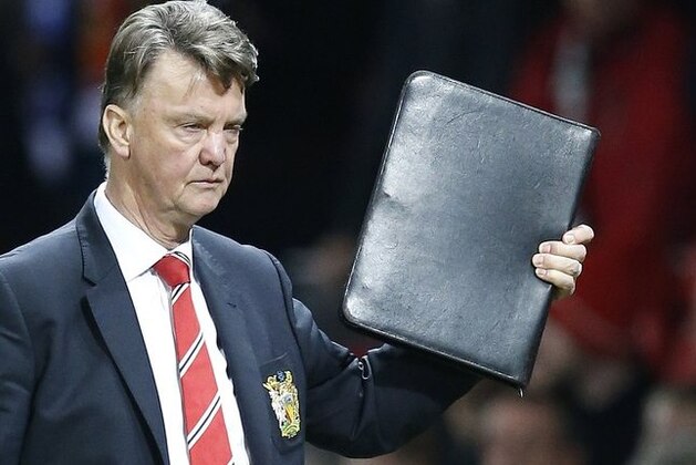 Manchester United's manager Louis van Gaal leaves at the end of the English Premier League soccer match between Manchester United and Chelsea at Old Trafford Stadium, Manchester, England, Monday, Dec. 28, 2015. (AP Photo/Jon Super)