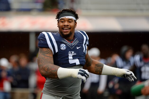 Mississippi defensive tackle Robert Nkemdiche (5) stretches before an NCAA college football game between Mississippi and Arkansas in Oxford, Miss., Saturday, Nov. 7, 2015. (AP Photo/Thomas Graning)