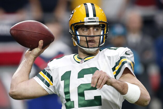Green Bay Packers quarterback Aaron Rodgers (12) throws against the Arizona Cardinals during the first half of an NFL football game, Sunday, Dec. 27, 2015, in Glendale, Ariz. (AP Photo/Ross D. Franklin)