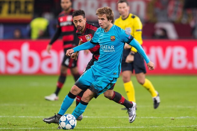 (L-R) Karim Bellarabi of Bayer 04 Leverkusen, Sergi Samper of FC Barcelona during the UEFA Champions League match between Bayer 04 Leverkusen and FC Barcelona on December 9, 2015 at the BayArena in Leverkusen, Germany.(Photo by VI Images via Getty Images)
