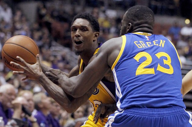 Los Angeles Lakers guard Lou Williams, left, is fouled by Golden State Warriors forward Draymond Green (23) during the second half of an NBA preseason basketball game in Anaheim, Calif., Thursday, Oct. 22, 2015. The Warriors won 136-97. (AP Photo/Alex Gallardo)