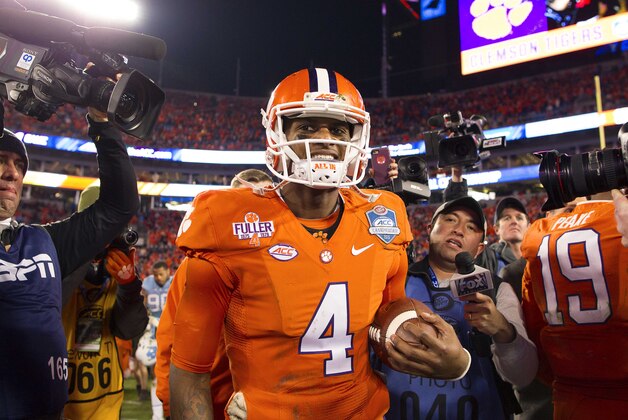 Dec 5, 2015; Charlotte, NC, USA; Clemson Tigers quarterback Deshaun Watson (4) walks off the field after defeating the North Carolina Tar Heels 45-37 in the ACC football championship game at Bank of America Stadium. Mandatory Credit: Joshua S. Kelly-USA TODAY Sports