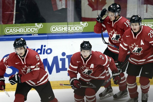 From left, Canada's Dylan Strome, Joe Hicketts, Jake Virtanen and Lawson Crouse celebrate Strome's 2-1 goal, during the 2016 World Junior  Hockey Championships tournament match between Switzerland and Canada in Helsinki, Finland, Tuesday, Dec. 29, 2015. (Heikki Saukkomaa/Lehtikuva via AP)  FINLAND OUT