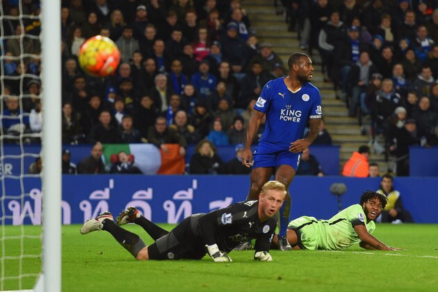 LEICESTER, ENGLAND - DECEMBER 29:  Raheem Sterling of Manchester City (R) looks on as his shot is saved by goalkeeper Kasper Schmeichel of Leicester City during the Barclays Premier League match between Leicester City and Manchester City at The King Power Stadium on December 29, 2015 in Leicester, England.  (Photo by Michael Regan/Getty Images)