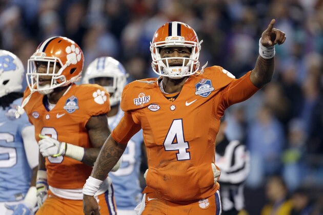 Clemson's Deshaun Watson (4) celebrates his touchdown against North Carolina during the first half of the Atlantic Coast Conference championship NCAA college football game in Charlotte, N.C., Saturday, Dec. 5, 2015. (AP Photo/Bob Leverone)