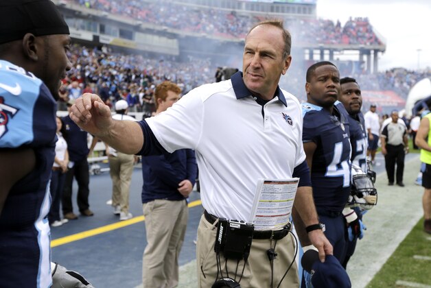 Tennessee Titans interim head coach Mike Mularkey talks with players before an NFL football game against the Houston Texans Sunday, Dec. 27, 2015, in Nashville, Tenn. (AP Photo/James Kenney)