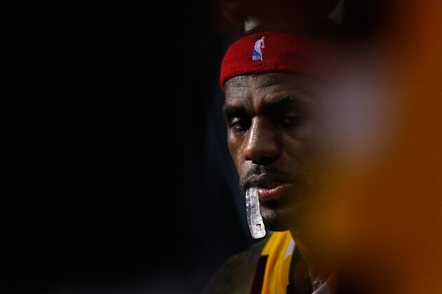 PHOENIX, AZ - DECEMBER 28:  LeBron James #23 of the Cleveland Cavaliers sits on the bench during a time out in the second half of the NBA game against the Phoenix Suns at Talking Stick Resort Arena on December 28, 2015 in Phoenix, Arizona. The Cavaliers defeated the Suns 101-97.  NOTE TO USER: User expressly acknowledges and agrees that, by downloading and or using this photograph, User is consenting to the terms and conditions of the Getty Images License Agreement.  (Photo by Christian Petersen/Getty Images)