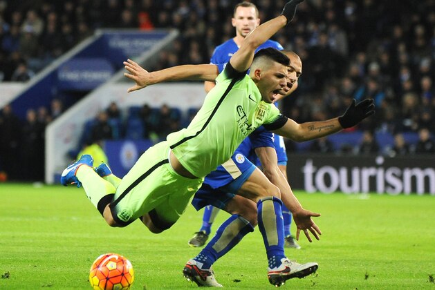 Manchester City’s Sergio Aguero, front, is tackled by Leicester’s Gokhan Inler during the English Premier League soccer match between Leicester City and Manchester City at the King Power Stadium in Leicester, England, Tuesday, Dec. 29, 2015. (AP Photo/Rui Vieira)