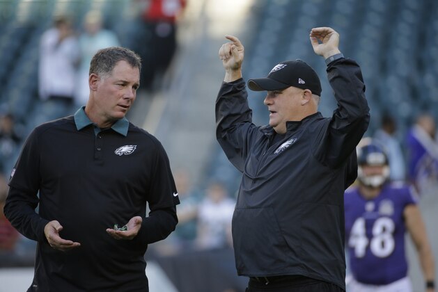 Philadelphia Eagles head coach Chip Kelly, right and offensive coordinator Pat Shurmur talk before a preseason NFL football game against the Baltimore Ravens, Saturday, Aug. 22, 2015, in Philadelphia. (AP Photo/Michael Perez)