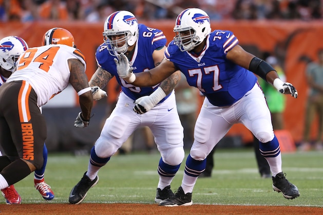 Buffalo Bills tackle Cordy Glenn (77) and Richie Incognito (64) against Cleveland Browns defensive tackle Randy Starks (94) in an NFL preseason football game, Thursday, Aug. 20, 2015, in Cleveland. (AP Photo/Ron Schwane)