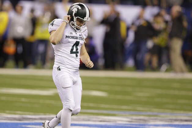 Michigan State place kicker Michael Geiger reacts after missing a field goal against Iowa during the first half of the Big Ten Conference championship NCAA college football game Saturday, Dec. 5, 2015, in Indianapolis. (AP Photo/Michael Conroy)
