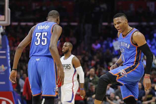 Oklahoma City Thunder's Kevin Durant, left, and Russell Westbrook celebrate a basket made by Durant during the second half of an NBA basketball game against the Los Angeles Clippers, Monday, Dec. 21, 2015, in Los Angeles. The Thunder won 100-99. (AP Photo/Jae C. Hong)