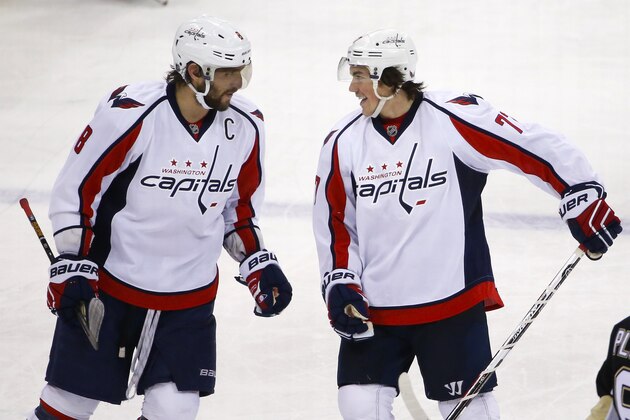 Washington Capitals' T.J. Oshie, right, celebrates his first of two goals in the third period with teammate Alex Ovechkin, left, during an NHL hockey game in Pittsburgh Monday, Dec. 14, 2015. The Capitals won 4-1. (AP Photo/Gene J. Puskar)