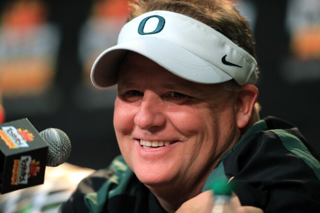 GLENDALE, AZ - JANUARY 03:  Head coach Chip Kelly of the Oregon Ducks participates in a post-game press conference after they defeated the Kansas State Wildcats 35 to 17 in the Tostitos Fiesta Bowl at University of Phoenix Stadium on January 3, 2013 in Glendale, Arizona.  (Photo by Doug Pensinger/Getty Images)