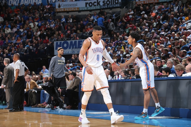 OKLAHOMA CITY, OK- DECEMBER 29:  Russell Westbrook #0 of the Oklahoma City Thunder shakes hands with Cameron Payne #22 of the Oklahoma City Thunder during the game against the Milwaukee Bucks on December 29, 2015 at Chesapeake Energy Arena in Oklahoma City, Oklahoma. NOTE TO USER: User expressly acknowledges and agrees that, by downloading and or using this photograph, User is consenting to the terms and conditions of the Getty Images License Agreement. Mandatory Copyright Notice: Copyright 2015 NBAE (Photo by Layne Murdoch/NBAE via Getty Images)