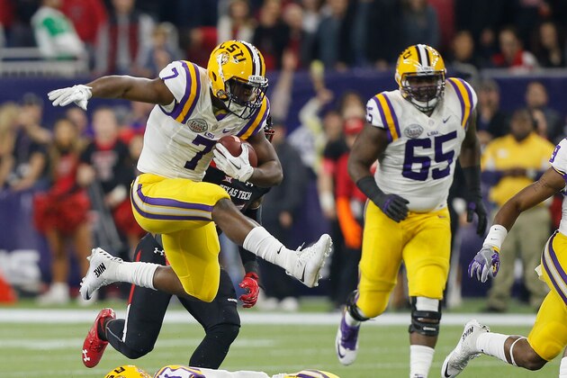 LSU running back Leonard Fournette (7) hurdles tight end Colin Jeter (81) as he rushes against Texas Tech during the first half of the Texas Bowl NCAA college football game Tuesday, Dec. 29, 2015, in Houston. (AP Photo/Bob Levey)