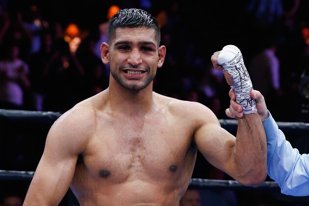 NEW YORK, NY - MAY 29:  Amir Khan raises his arms in victory after a unanimous decision win against Chris Algieri after their Welterweight bout at Barclays Center of Brooklyn on May 29, 2015 in New York City.  (Photo by Al Bello/Getty Images)