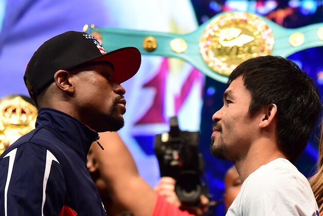 Floyd Mayweather and Manny Pacquiao face off following their weigh-in on May 1, 2015 in Las Vegas, Nevada one day before their 'Fight of the Century' on May 2 at the MGM Grand Garden Arena. AFP PHOTO / FREDERIC J. BROWN        (Photo credit should read FREDERIC J. BROWN/AFP/Getty Images)