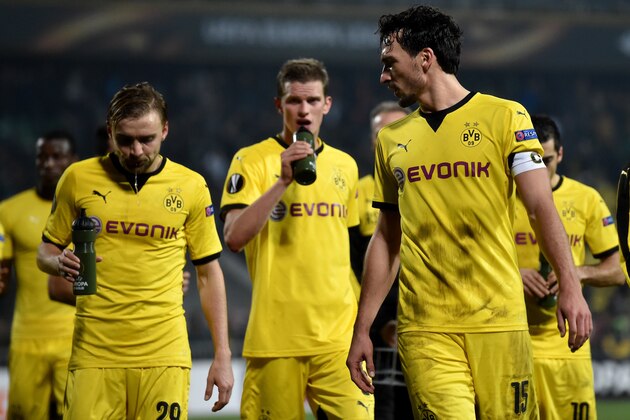 Dortmund's defender Marcel Schmelzer, Dortmund's midfielder Sven Bender and Dortmund's defender Mats Hummels react after the UEFA Europa League group C football match between FC Krasnodar and Borussia Dortmund in Krasnodar on November 26, 2015. AFP PHOTO / KIRILL KUDRYAVTSEV / AFP / KIRILL KUDRYAVTSEV        (Photo credit should read KIRILL KUDRYAVTSEV/AFP/Getty Images)
