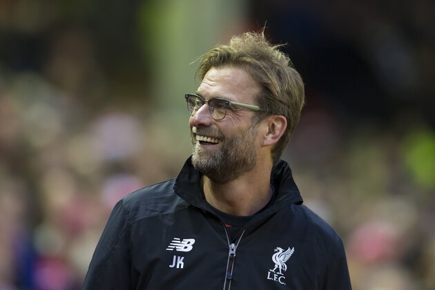 Liverpool's manager Juergen Klopp smiles as he takes to the touchline before his team's English Premier League soccer match between Liverpool and Leicester City at Anfield Stadium, Liverpool, England, Saturday, Dec. 26, 2015. (AP Photo/Jon Super)