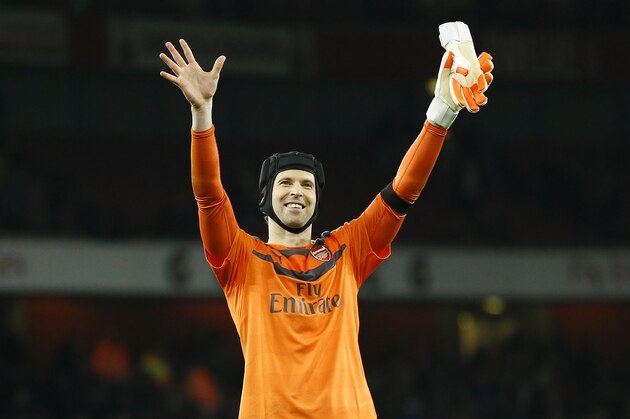 Arsenal's Petr Cech waves to the fans at the end of the English Premier League soccer match between Arsenal and Bournemouth at Emirates stadium in London, Monday, Dec. 28, 2015. Arsenal won the match 2-0, they now go top of the Premier League table. (AP Photo/Kirsty Wigglesworth)
