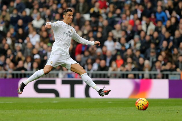 Real Madrid's Portuguese forward Cristiano Ronaldo kicks the ball during the Spanish league football match Real Madrid CF vs Real Sociedad de Futbol at the Santiago Bernabeu stadium in Madrid on December 30, 2015.   AFP PHOTO/ CESAR MANSO / AFP / CESAR MANSO        (Photo credit should read CESAR MANSO/AFP/Getty Images)
