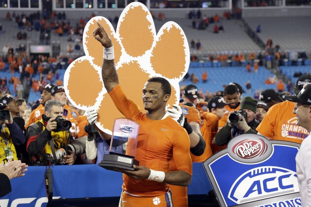 Clemson quarterback Deshaun Watson holds the most valuable player trophy after Clemson defeated North Carolina 45-37 in the Atlantic Coast Conference championship NCAA college football game in Charlotte, N.C., Sunday, Dec. 6, 2015. (AP Photo/Bob Leverone)