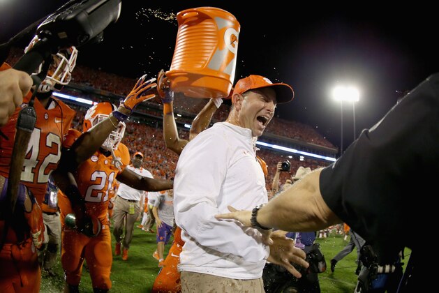 CLEMSON, SC - NOVEMBER 07:  Head coach Dabo Swinney of the Clemson Tigers celebrates with his team after defeating the Florida State Seminoles 23-13 at Memorial Stadium on November 7, 2015 in Clemson, South Carolina.  (Photo by Streeter Lecka/Getty Images)